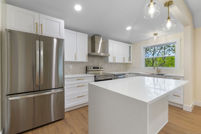 145 Lakeview Dr, Colchester, CT 06415 - kitchen featuring appliances with stainless steel finishes, wall chimney range hood, light countertops, backsplash, and recessed lighting