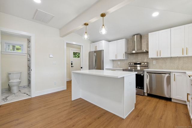 145 Lakeview Dr, Colchester, CT 06415 - kitchen with stainless steel appliances, wall chimney exhaust hood, white cabinets, and recessed lighting