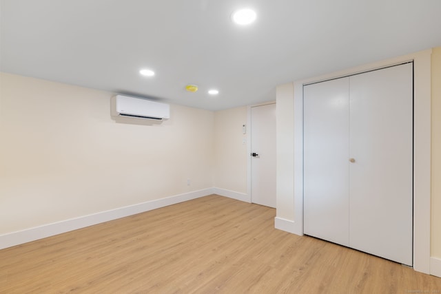 145 Lakeview Dr, Colchester, CT 06415 - unfurnished bedroom with light wood finished floors, recessed lighting, a closet, and a wall mounted air conditioner
