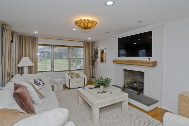 120 Scenic View Dr, Middletown, CT 06457 - living area featuring wood finished floors, a fireplace with raised hearth, and recessed lighting