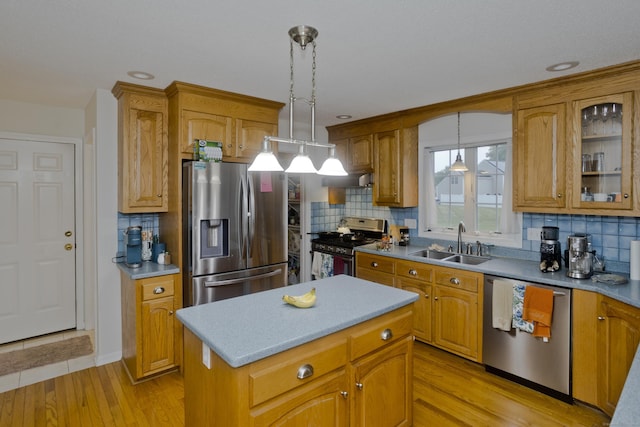 120 Scenic View Dr, Middletown, CT 06457 - kitchen with stainless steel appliances, decorative light fixtures, tasteful backsplash, brown cabinetry, and recessed lighting