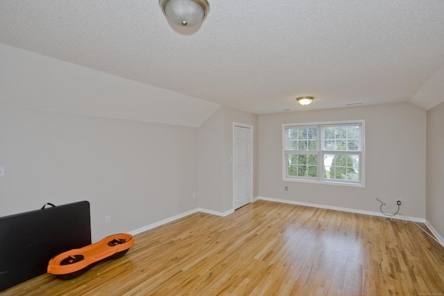 120 Scenic View Dr, Middletown, CT 06457 - bonus room featuring light wood finished floors, vaulted ceiling, and a textured ceiling