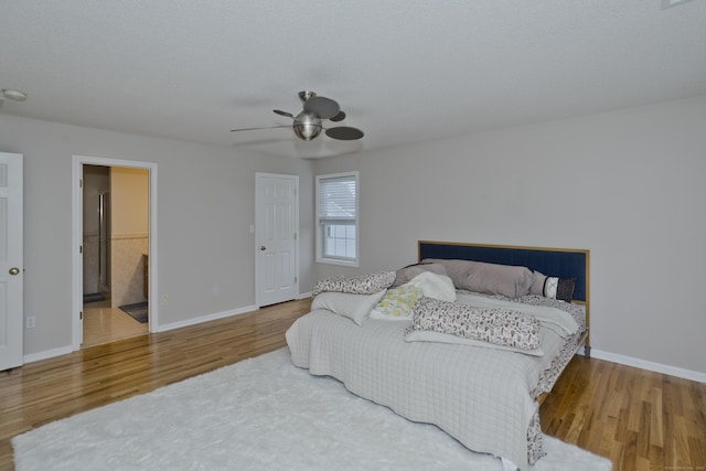 120 Scenic View Dr, Middletown, CT 06457 - bedroom with wood finished floors, a ceiling fan, and ensuite bath