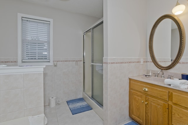 120 Scenic View Dr, Middletown, CT 06457 - full bath featuring tile walls, a stall shower, vanity, wainscoting, and tile patterned floors