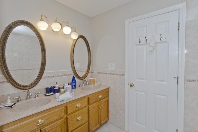 120 Scenic View Dr, Middletown, CT 06457 - bathroom featuring tile walls, double vanity, tile patterned flooring, and wainscoting