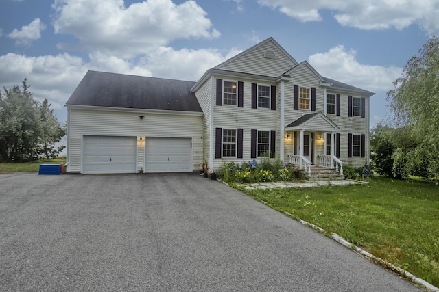 120 Scenic View Dr, Middletown, CT 06457 - colonial-style house featuring an attached garage, asphalt driveway, and a front yard