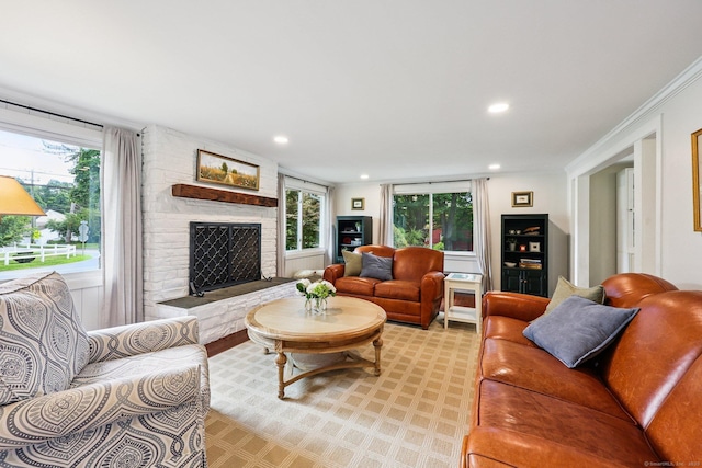 103 Glenwood Rd, Clinton, CT 06413 - living room with healthy amount of natural light, a large fireplace, recessed lighting, and ornamental molding