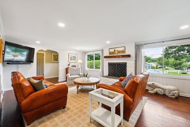 103 Glenwood Rd, Clinton, CT 06413 - living area with arched walkways, recessed lighting, light wood-style floors, and a large fireplace