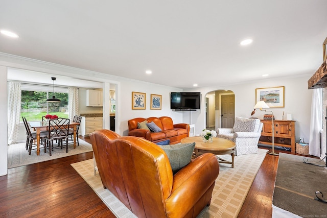 103 Glenwood Rd, Clinton, CT 06413 - living room featuring crown molding, arched walkways, dark wood finished floors, and recessed lighting