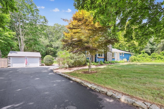 103 Glenwood Rd, Clinton, CT 06413 - view of front of house with a front lawn, an outdoor structure, and a detached garage