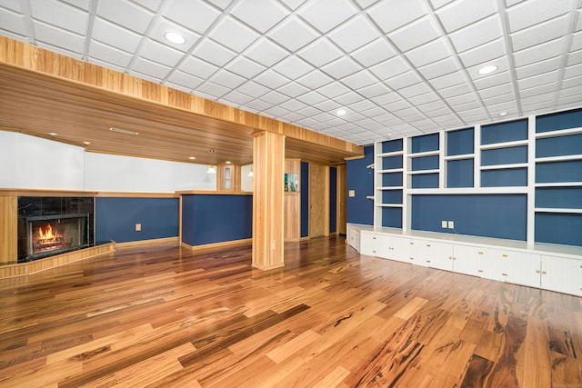 34 Cortland Way Unit 34, Newington, CT 06111 - unfurnished living room featuring built in features, a lit fireplace, wood finished floors, and recessed lighting