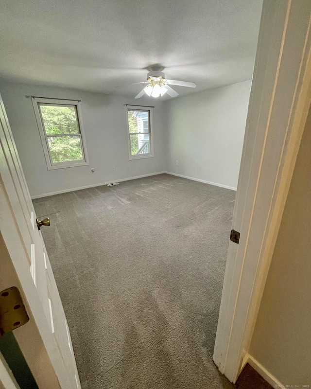 1 Rushford Meade Unit 1, Granby, CT 06035 - empty room with carpet flooring, ceiling fan, and a textured ceiling