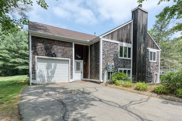 120 Songbird Ln Unit 120, Farmington, CT 06032 - view of front of house with asphalt driveway and an attached garage