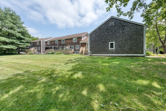 120 Songbird Ln Unit 120, Farmington, CT 06032 - back of property featuring a deck and a lawn
