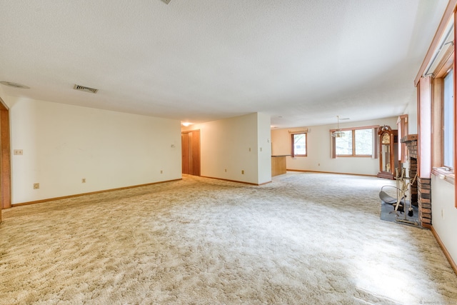 120 Songbird Ln Unit 120, Farmington, CT 06032 - unfurnished living room with light colored carpet and a textured ceiling