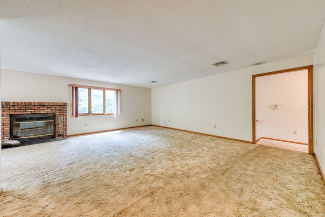 120 Songbird Ln Unit 120, Farmington, CT 06032 - unfurnished living room with carpet floors, a textured ceiling, and a fireplace