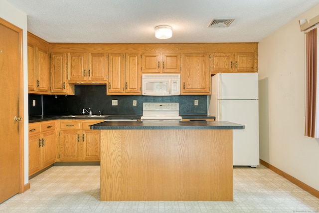 120 Songbird Ln Unit 120, Farmington, CT 06032 - kitchen with white appliances, light floors, dark countertops, and a kitchen island