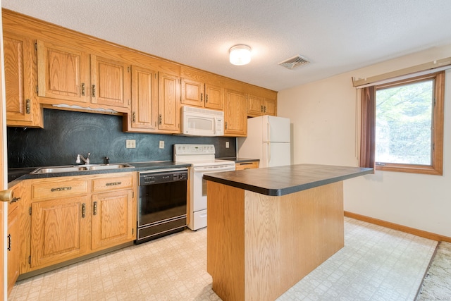 120 Songbird Ln Unit 120, Farmington, CT 06032 - kitchen with white appliances, dark countertops, light flooring, decorative backsplash, and a textured ceiling