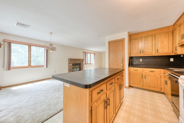 120 Songbird Ln Unit 120, Farmington, CT 06032 - kitchen featuring dark countertops, open floor plan, a fireplace, a kitchen island, and a textured ceiling