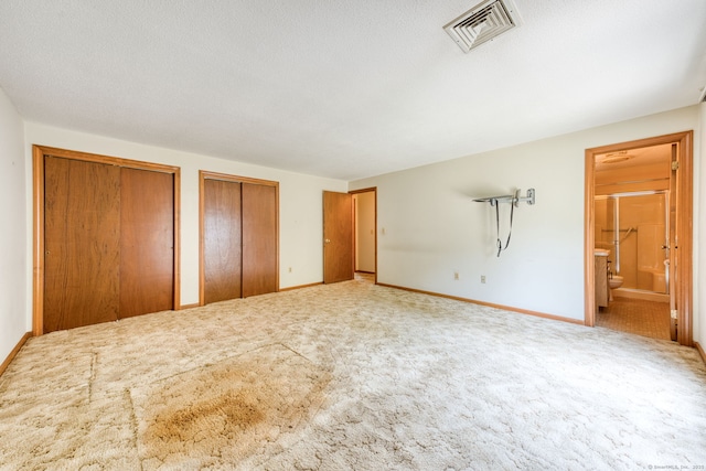 120 Songbird Ln Unit 120, Farmington, CT 06032 - unfurnished bedroom with two closets, carpet floors, and ensuite bath