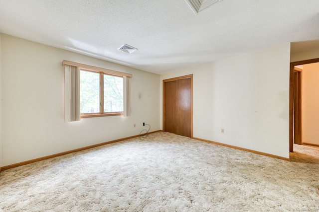 120 Songbird Ln Unit 120, Farmington, CT 06032 - spare room featuring carpet floors and a textured ceiling