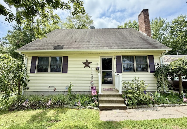 18 Booth Rd, Enfield, CT 06082 - view of front facade featuring a chimney and roof with shingles