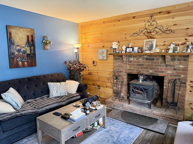 18 Booth Rd, Enfield, CT 06082 - living area with wood finished floors, a wood stove, and wooden walls
