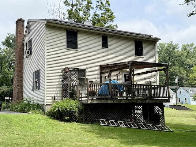 18 Booth Rd, Enfield, CT 06082 - back of property featuring a wooden deck, a yard, a chimney, and cooling unit
