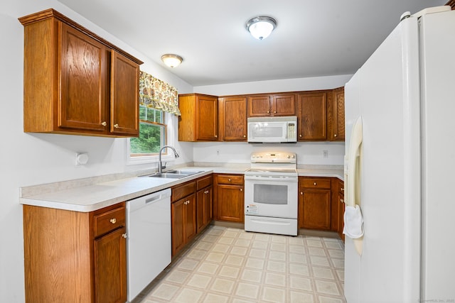 2 Autumn Way, Ledyard, CT 06339 - kitchen featuring white appliances, light floors, brown cabinetry, and light countertops