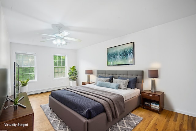 2 Autumn Way, Ledyard, CT 06339 - bedroom with a baseboard radiator, light wood-style flooring, and a ceiling fan