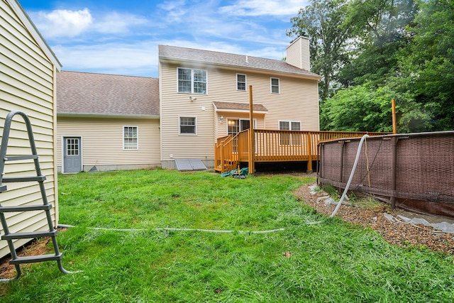 2 Autumn Way, Ledyard, CT 06339 - back of house featuring a deck, a lawn, roof with shingles, and a chimney