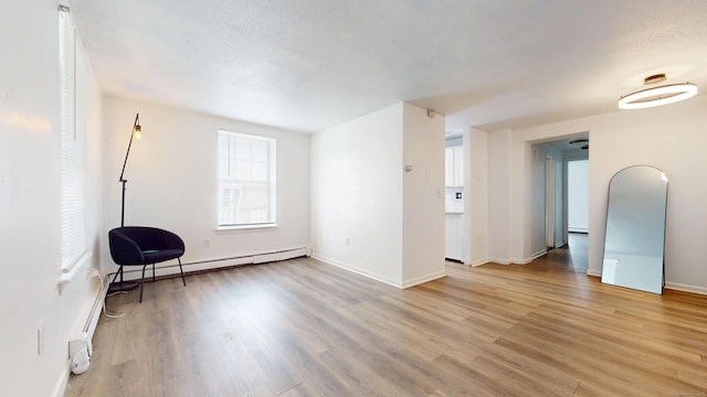 64 Van Block Ave Unit 9B, Hartford, CT 06106 - unfurnished room with light wood-type flooring and a baseboard radiator