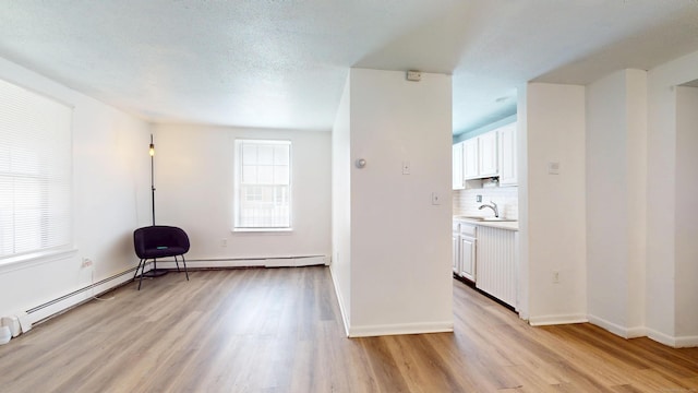 64 Van Block Ave Unit 9B, Hartford, CT 06106 - unfurnished room featuring light wood-style floors and baseboard heating