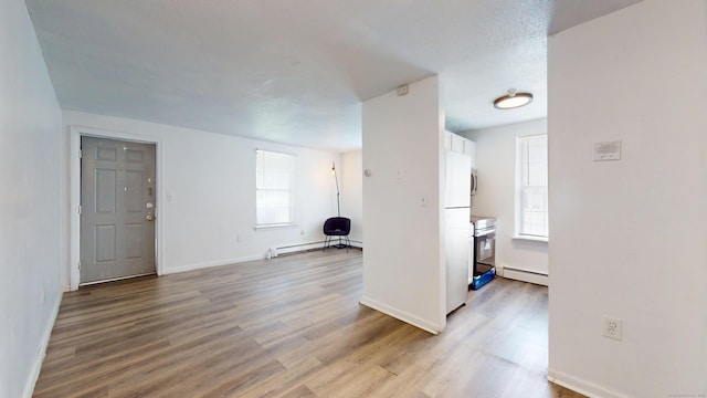 64 Van Block Ave Unit 9B, Hartford, CT 06106 - foyer entrance with wood finished floors and a baseboard radiator