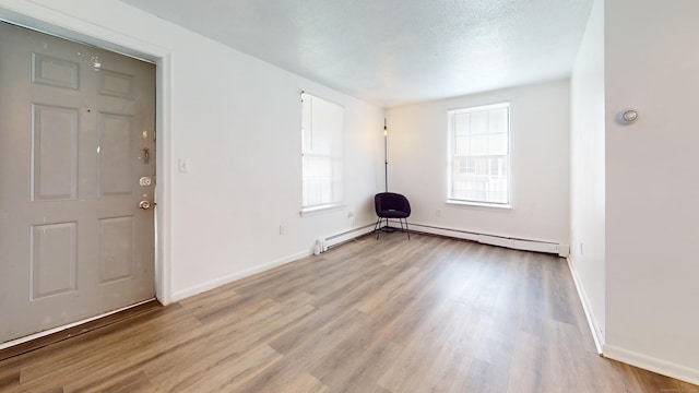 64 Van Block Ave Unit 9B, Hartford, CT 06106 - entrance foyer featuring light wood-style flooring and a baseboard radiator