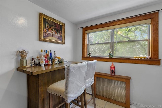 11 Bedford Ave Apt J2, Norwalk, CT 06850 - indoor dry bar featuring healthy amount of natural light and light tile patterned floors