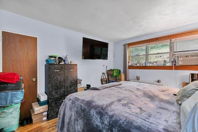 11 Bedford Ave Apt J2, Norwalk, CT 06850 - bedroom featuring cooling unit and wood finished floors