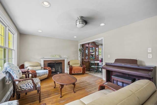 1 Oakridge Dr, Enfield, CT 06082 - living room with wood finished floors, ceiling fan, a brick fireplace, and recessed lighting
