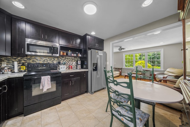1 Oakridge Dr, Enfield, CT 06082 - kitchen featuring appliances with stainless steel finishes, backsplash, light stone countertops, light tile patterned flooring, and recessed lighting