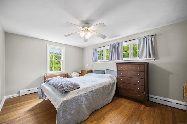 1 Oakridge Dr, Enfield, CT 06082 - bedroom featuring baseboard heating, wood finished floors, and ceiling fan
