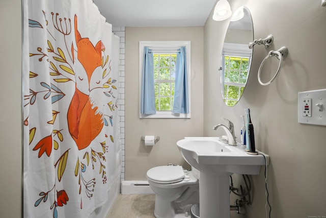 1 Oakridge Dr, Enfield, CT 06082 - bathroom featuring tile patterned floors, a shower with shower curtain, and a baseboard heating unit