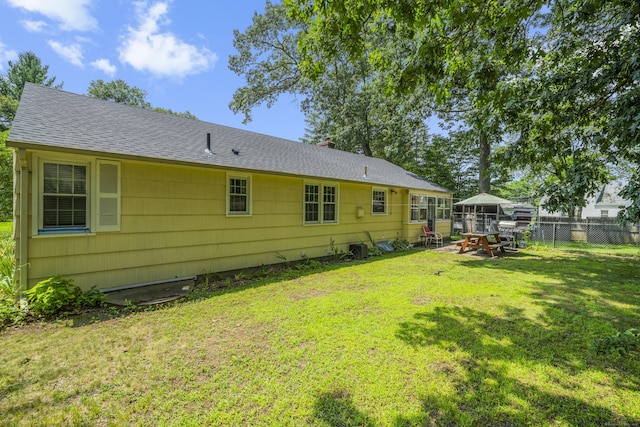 1 Oakridge Dr, Enfield, CT 06082 - back of house with a shingled roof