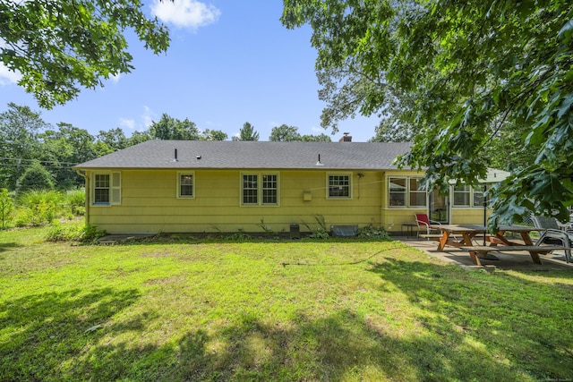 1 Oakridge Dr, Enfield, CT 06082 - rear view of property with a patio, a yard, a chimney, and a shingled roof