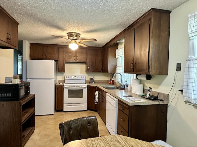 52 Midland Rd, Windsor Locks, CT 06096 - kitchen with white appliances, dark brown cabinets, light countertops, a ceiling fan, and a textured ceiling