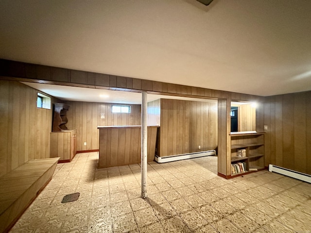 52 Midland Rd, Windsor Locks, CT 06096 - basement featuring a baseboard radiator, wooden walls, and a bar