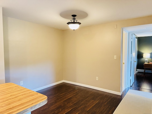 110 Trolley Crossing Ln Unit 110, Middletown, CT 06457 - unfurnished dining area featuring dark wood-type flooring and baseboards
