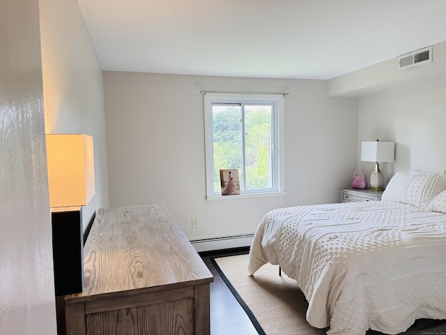 110 Trolley Crossing Ln Unit 110, Middletown, CT 06457 - bedroom featuring baseboard heating and wood finished floors