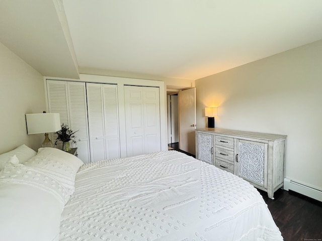 110 Trolley Crossing Ln Unit 110, Middletown, CT 06457 - bedroom with two closets, dark wood-type flooring, and baseboard heating