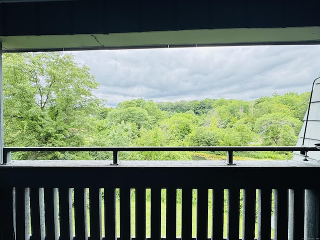 110 Trolley Crossing Ln Unit 110, Middletown, CT 06457 - balcony featuring a view of trees