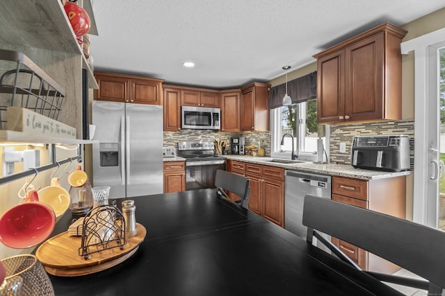 15 Arlington Rd, Windsor Locks, CT 06096 - kitchen featuring stainless steel appliances, tasteful backsplash, hanging light fixtures, a textured ceiling, and recessed lighting